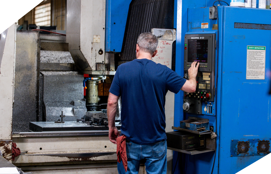 An engineer working on a machinery that supports consumer goods manufacturing.