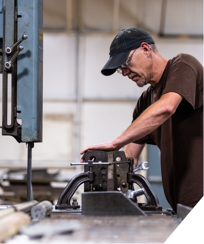 A worker creating a custom machine solutions.