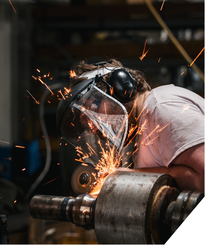 An engineer working on a Processing and Mixing machine.