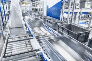 Conveyor in manufacturing facility