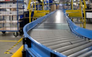 flat belt conveyor in manufacturing facility