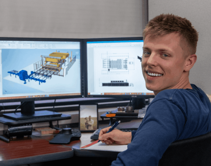 Engineer working on robotic machinery installation